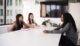 Three women sitting at the table