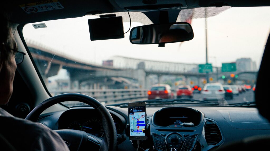 Man driving vehicle with GPS system