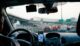 Man driving vehicle with GPS system