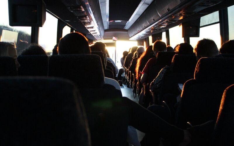 People riding passenger bus