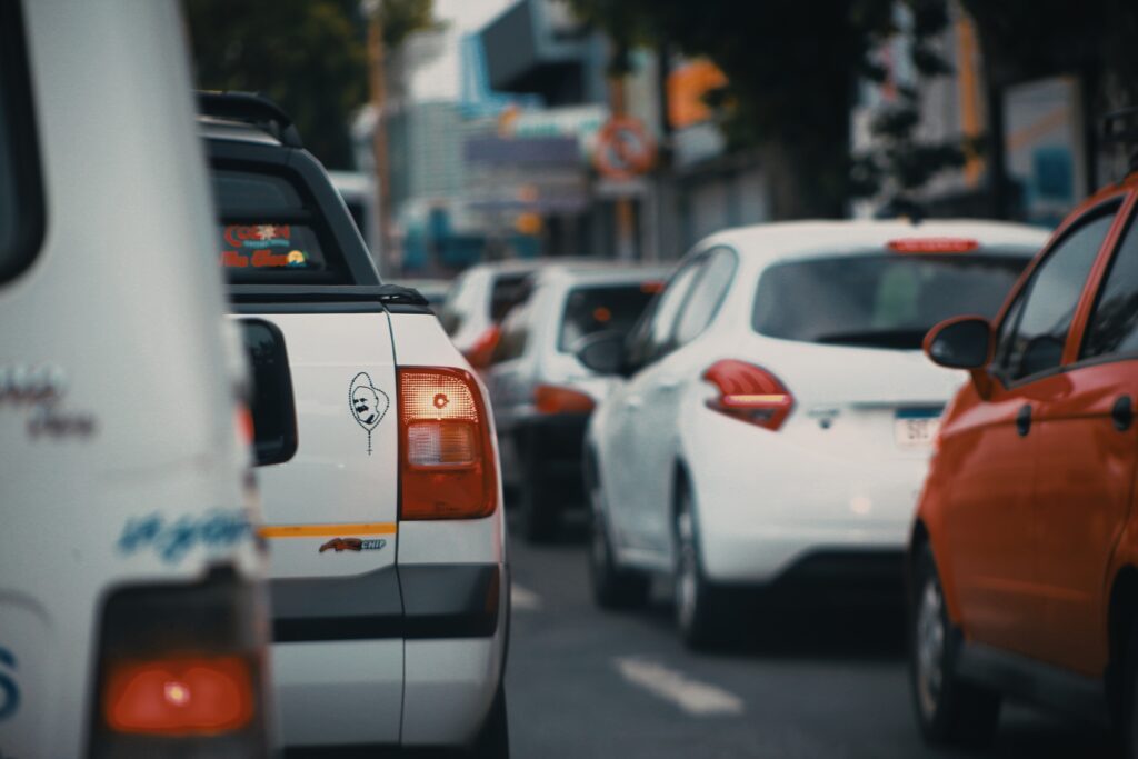 White and orange car on road